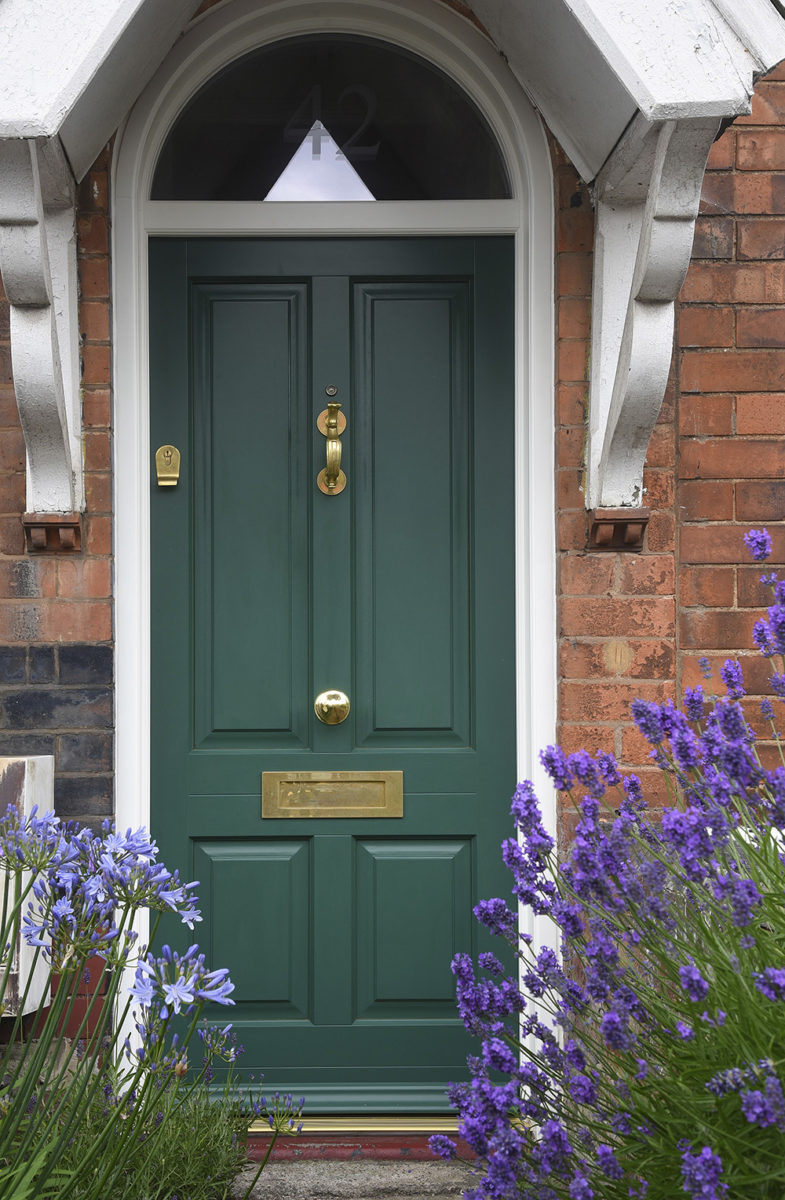 Bevington entrance door with arched toplight finished in Mustang Green
