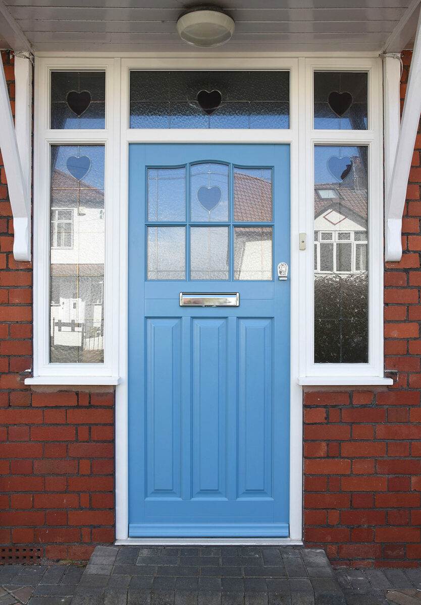 Conservation-timber-entrance-door-in-pastel-blue-finish-with-heart-shaped-stained-glass