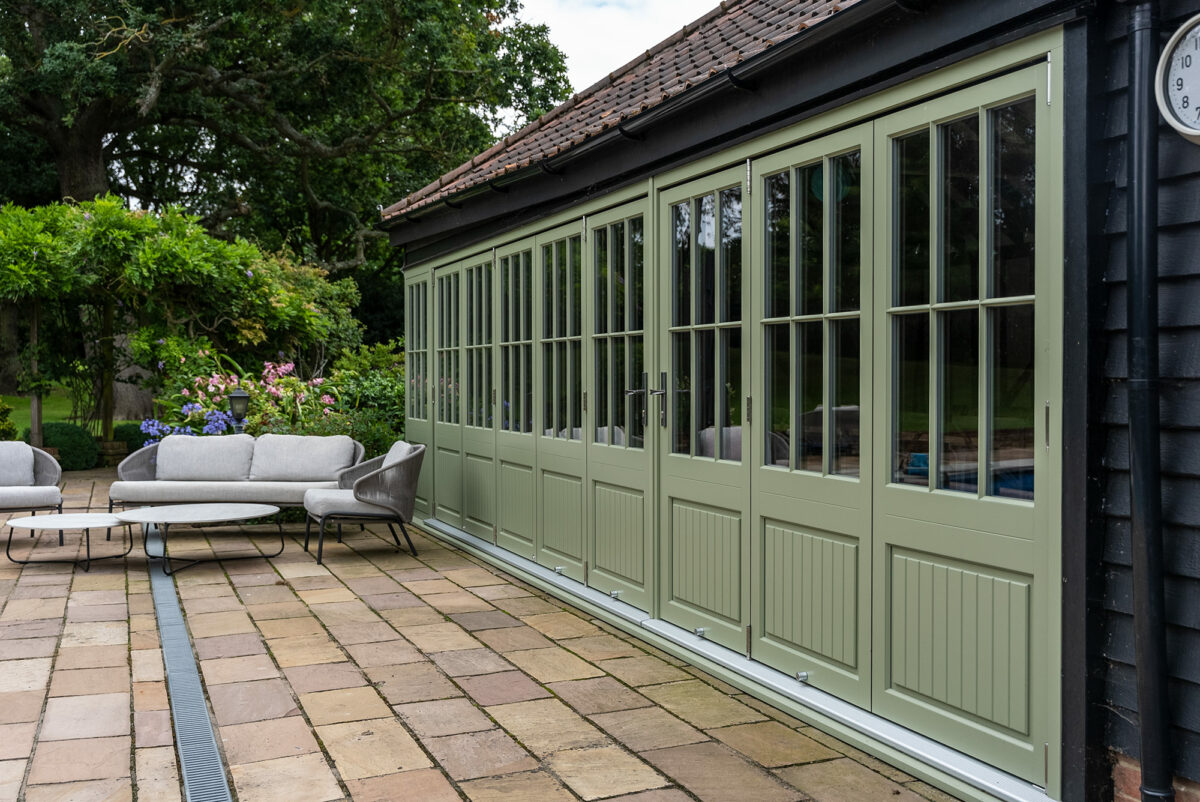 multiple sets of green bifold doors
