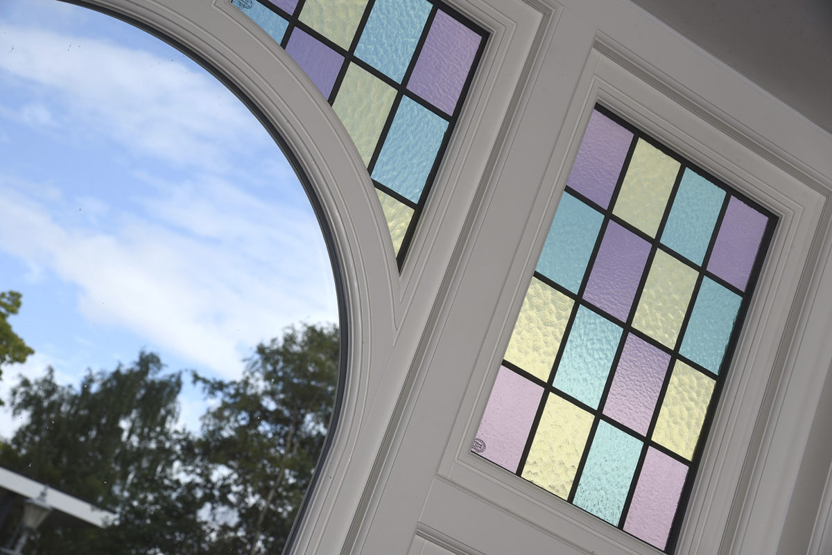 Flush casement windows in Off-White with bespoke stained glass