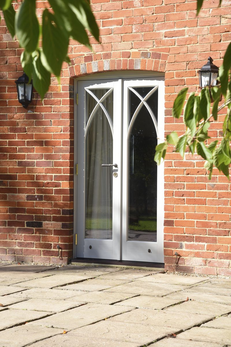 French doors with gothic arched glazing bars