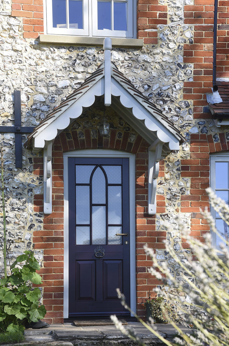 Moorbank conservation entrance door in a colour complementary to Fired Earth Carragheen