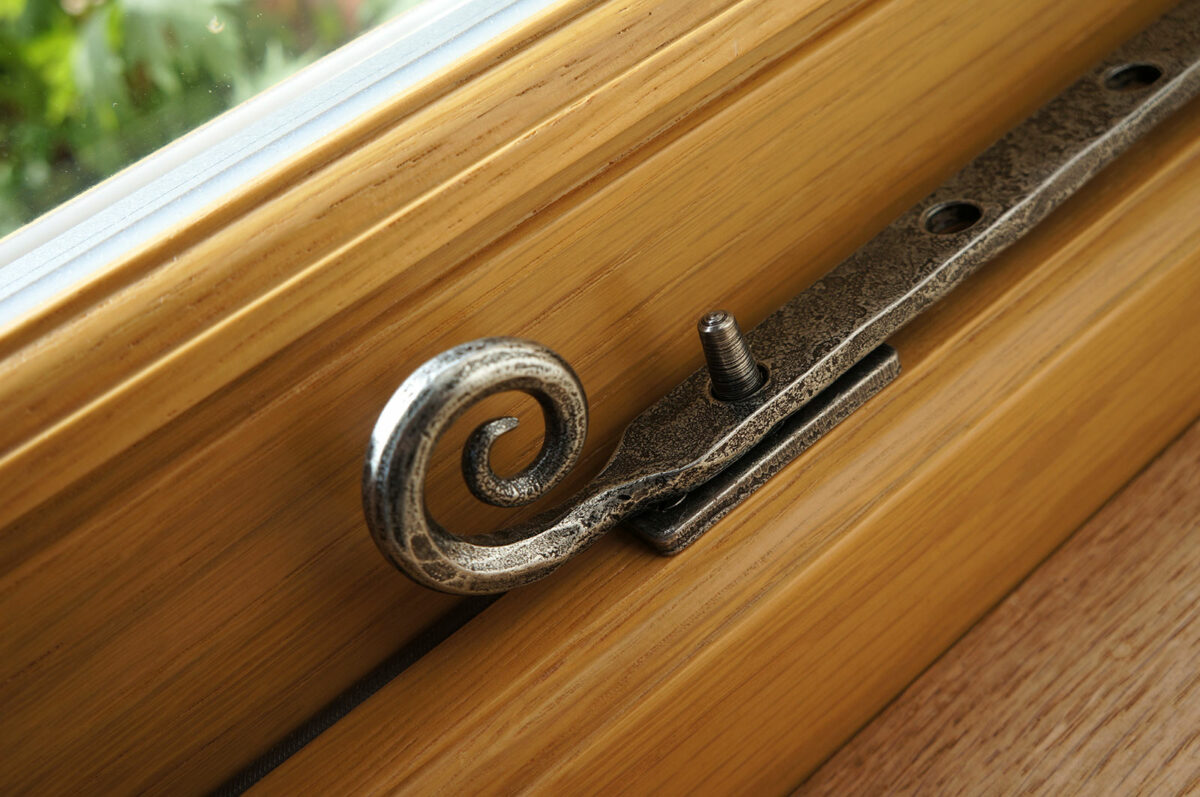 oak-stained-timber-windows-with-pewter-monkeytail-pegstay