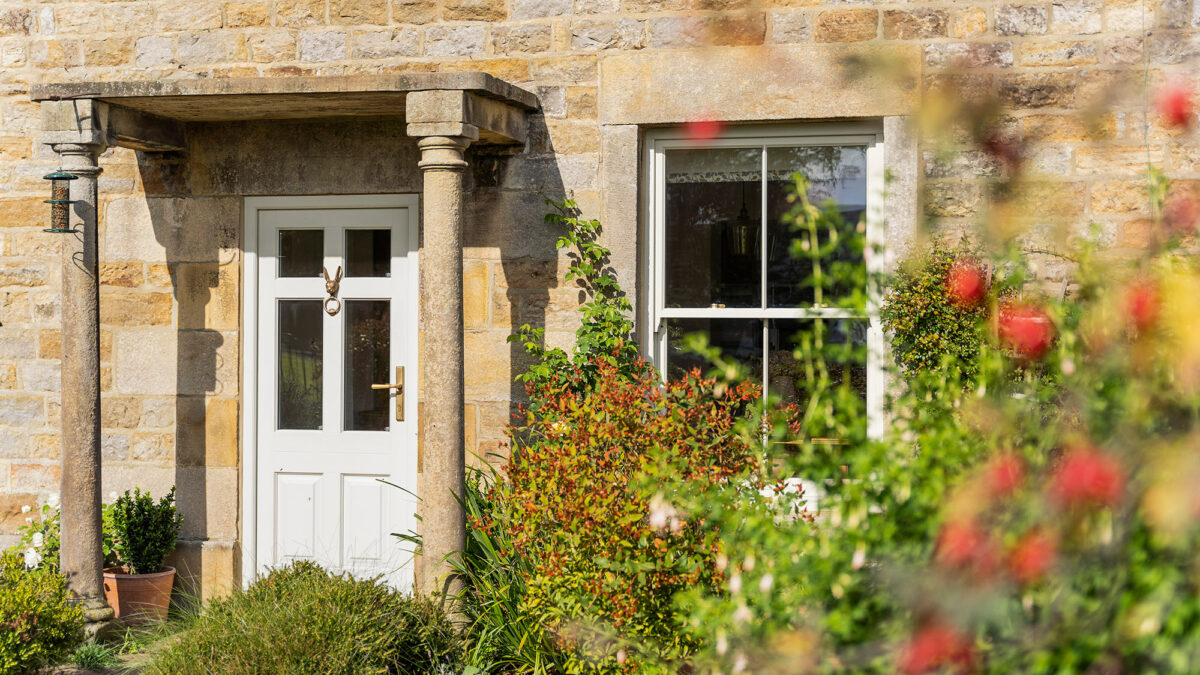 a white timber sash window and front door