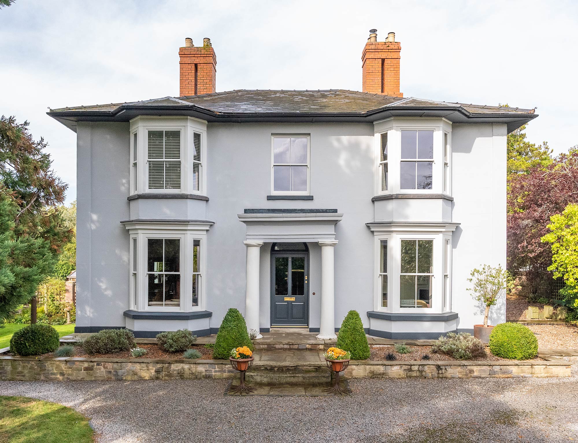 a beautiful rendered home with large victorian sash windows