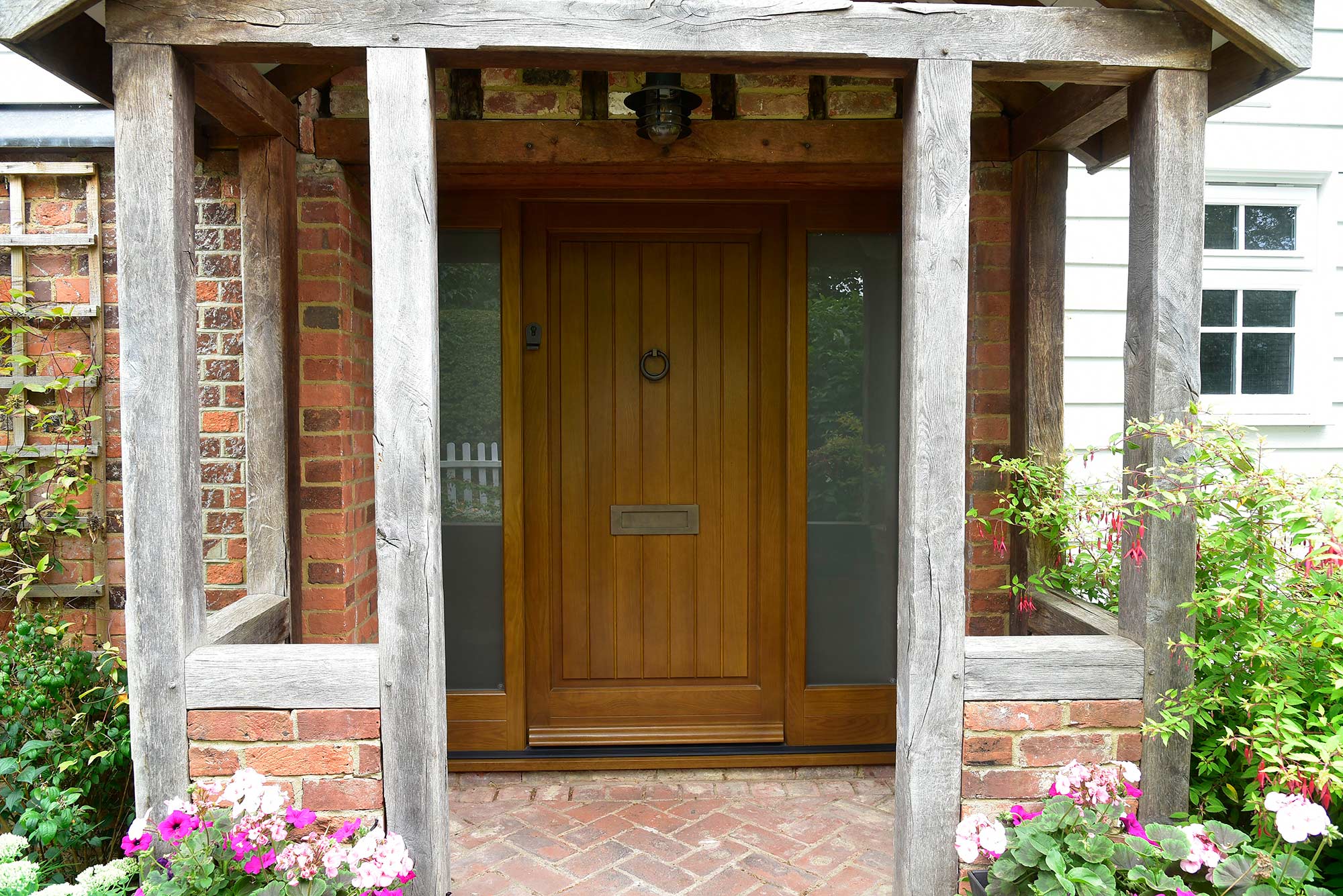 a fully panelled dark oak timber front door